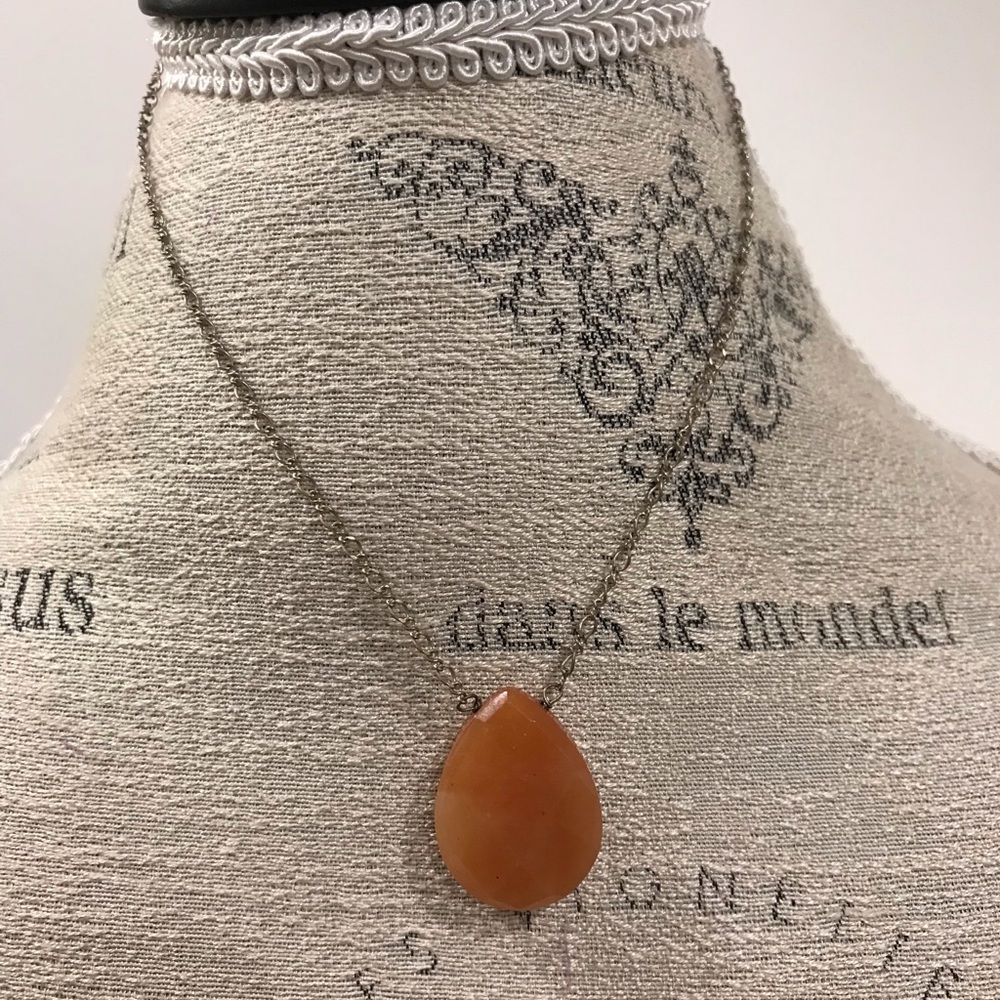 Silver tone necklace with amber pendant